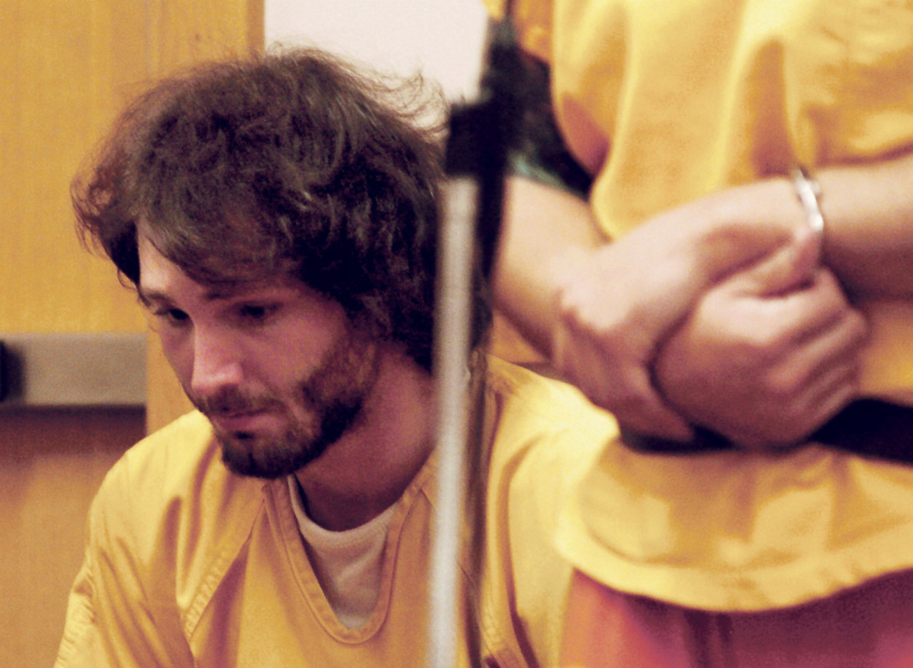 Zachary Casey looks up during a hearing along with his brother Alexis on charges of Class A arson in Skowhegan District Court on Wednesday.