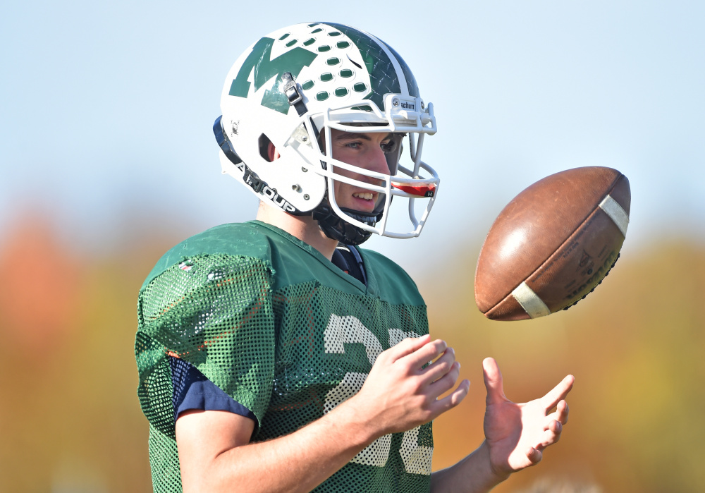 Mount View High School running back Colby Furrow tosses a football during practice in Thorndike on Wednesday.