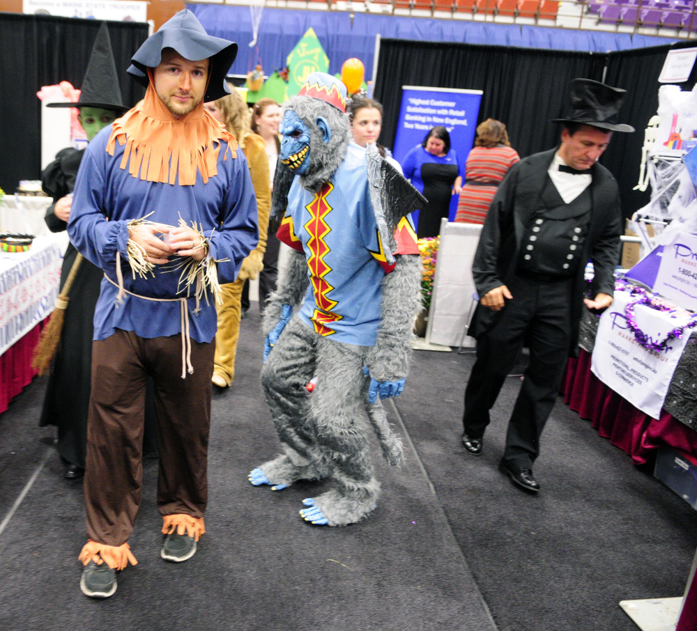 Maine State Credit Union employees dressed as characters from the movie "The Wizard of Oz" circulate among the booths Wednesday at the Kennebec Valley Chamber of Commerce EXPO on Wednesday at the Augusta Civic Center. Many people working at the show were in costume.