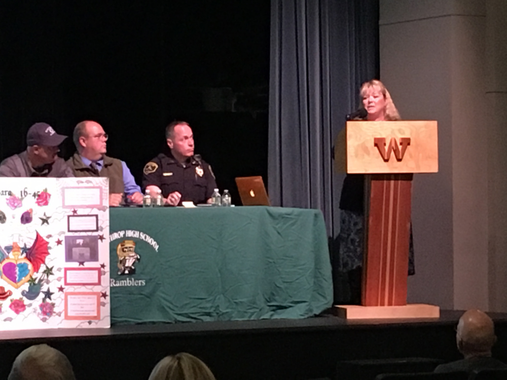 Donna Strickler, executive director of Sexual Assault Crisis & Support Center in Winthrop, addresses the approximately 60 people who attended a forum on opiate addiction at Winthrop High School.