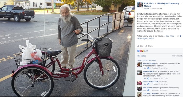 Neil Woodard, the "Bottle Man," shows off his new trike Luca with a cargo of empties in the back basket.