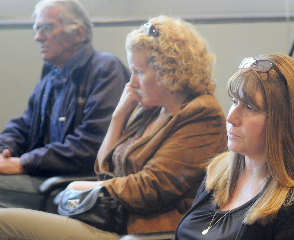 Friends and relatives of three people killed in a 1996 car crash listen to testimony Sept. 26 by Bryan Carrier at the Bureau of Motor Vehicles in Augusta. Relatives and friends of the victims are, from left, Royce Jewell and his partner, Tanya Morris, of Canaan; and Tracey Rotondi, of Athens.