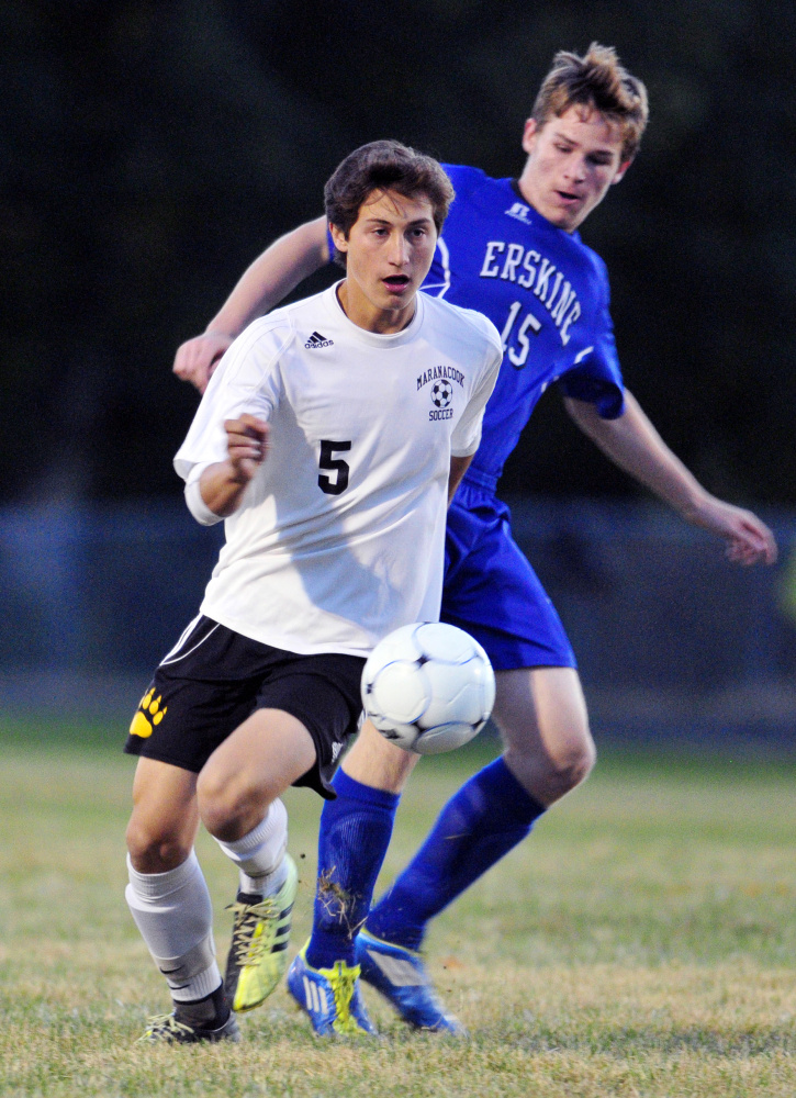 Maranacook's Jackson McPhedran, left, tries to get past Erskine's Christopher Weymouth during a game last season at the Ricky Gibson Field of Dreams in Readfield.