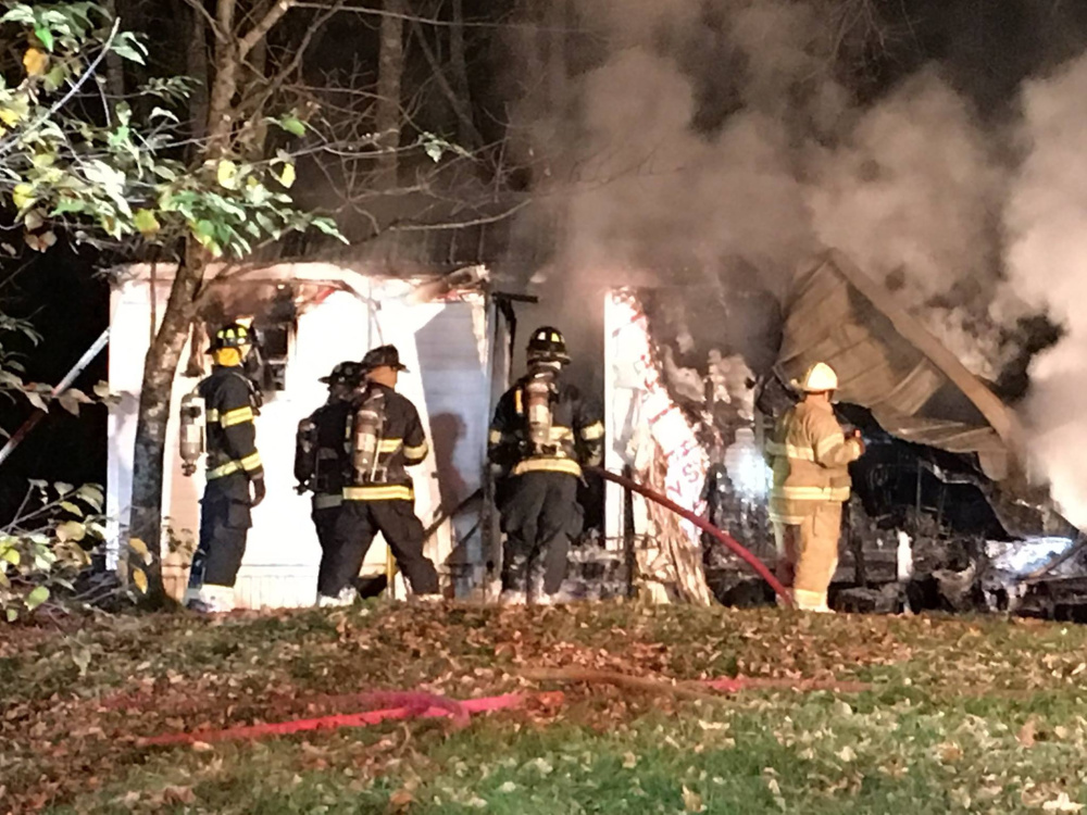 A mobile home was destroyed by fire on Route 133 in Winthrop early Thursday morning, and police later charged the homeowner with arson.
