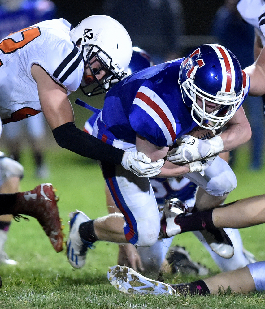 Messalonskee running back Austin Pelletier fights for a few extra yards during a game against Skowhegan earlier this season.