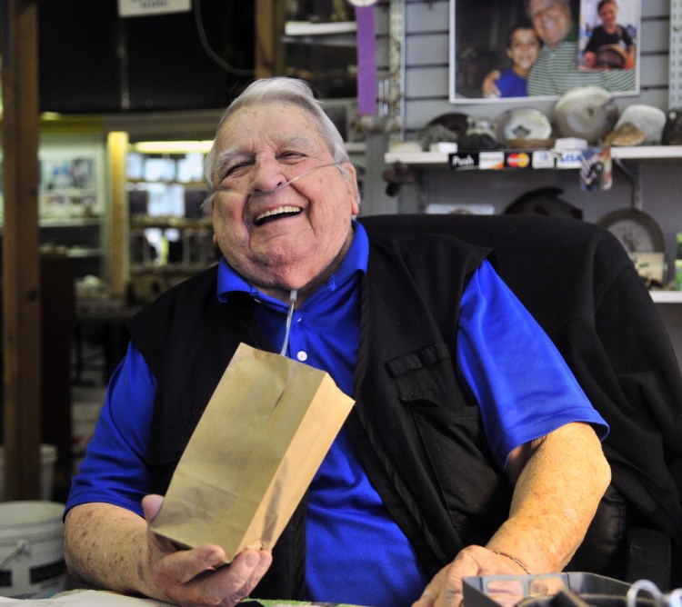 Levi "Sonny" Chavarie, who died Oct. 13 at age 91, laughs at something a customer said at his shop in Augusta in this 2015 file photo.