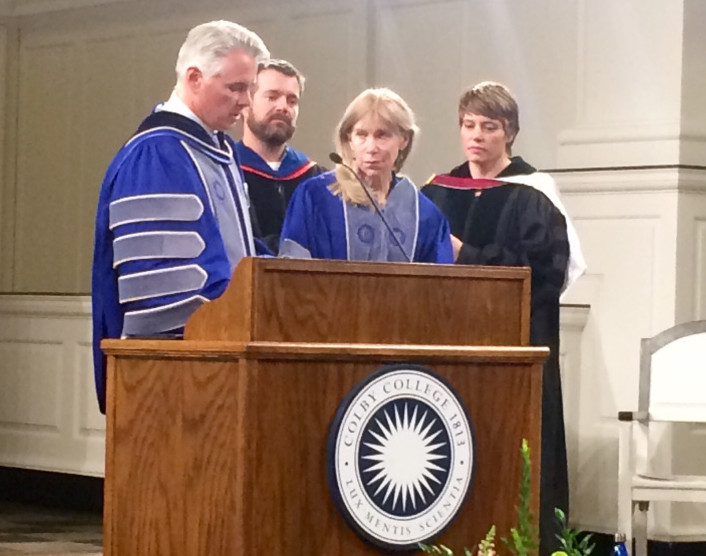 Colby College President David Greene, left, presents New York Times journalist Alissa Rubin, right, with an honorary degree and the Elijah Parish Lovejoy Award Monday night at Lorimer Chapel at Colby.