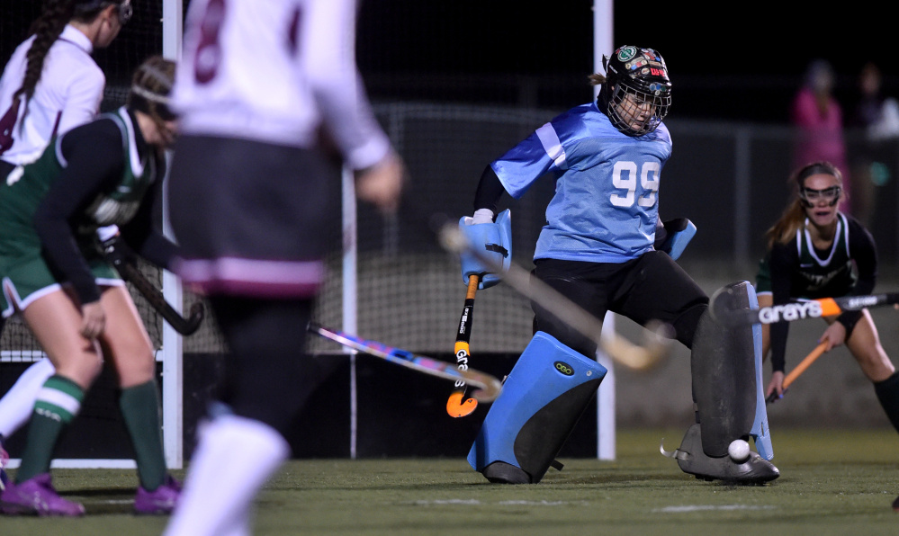 Winthrop goalie Corinna Coulton (99) makes a save against Maine Central Institute in the Class C North final Wednesday in Hampden.