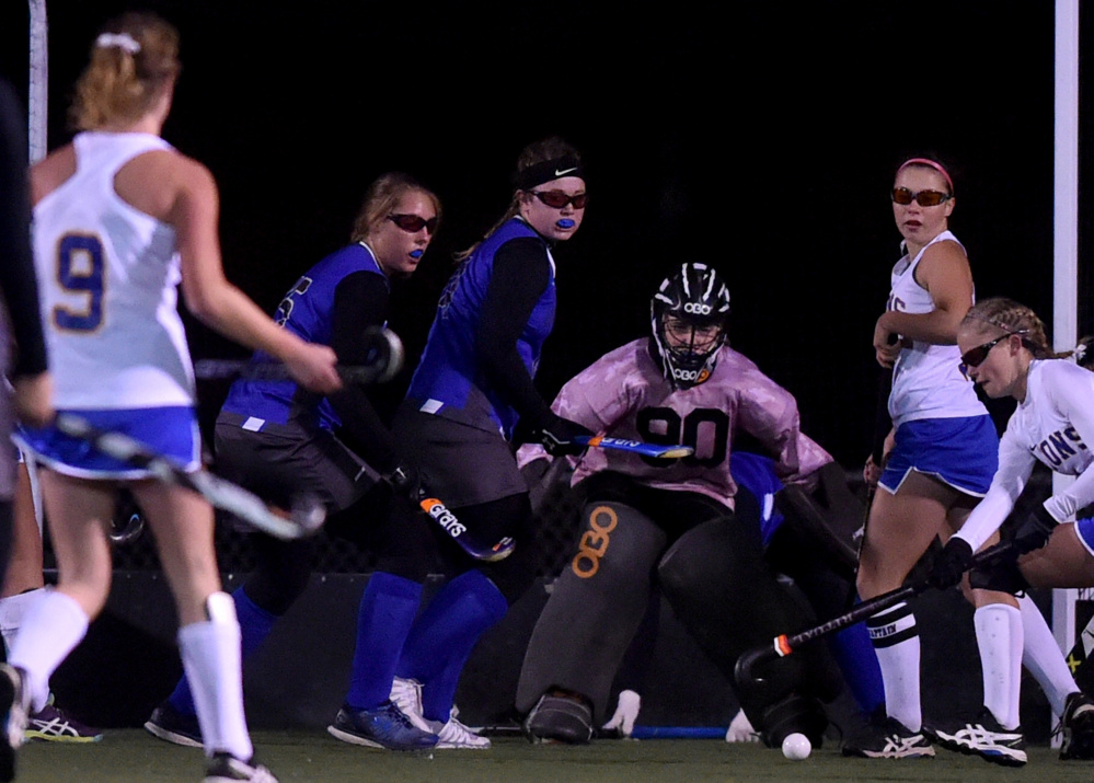 Staff photo by Michael G. Seamans
Lawrence goalie Marian Zawistowski makes a save during the Class B North final against Belfast on Wednesday night Hampden Academy.