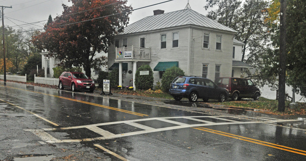 There is a proposal to move a crosswalk, shown in this Friday photo, south from its current location to run between Balloons & Things and Pincurl Beauty Shop, right, and the Maine Lakes Resource Center Annex and the Post Office in Belgrade Lakes village.