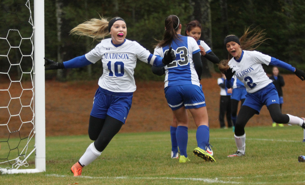 Madison midfielder Madeline Wood celebrates her eventual game-winning goal after beating Sacopee goalie Madison Day off a corner kick from Ashley Emery in the first half of a Class C South soccer semifinal in Madison on Saturday.