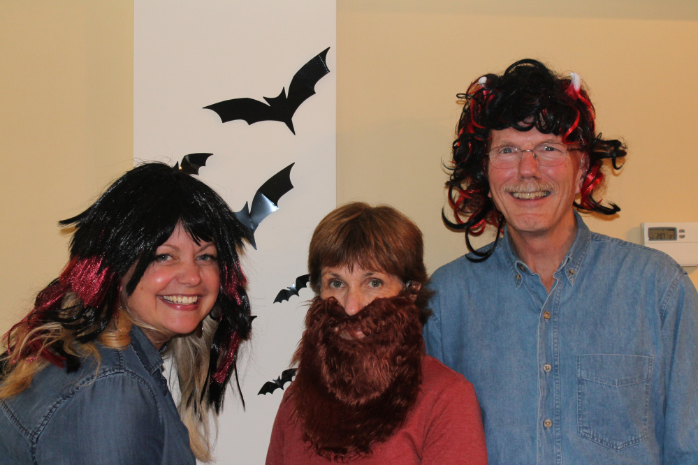 From left, Winthrop Lakes Region Chamber of Commerce Vice President Kim Stoneton, Executive Director Barbara Walsh and President Kim Vandermeulen celebrate Halloween and their new positions on the chamber board.