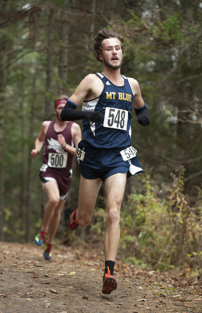 Tucker Barber, of Mt. Blue, leads the pack beyond the two-mile mark during the Class A North cross country championships Saturday in Belfast.