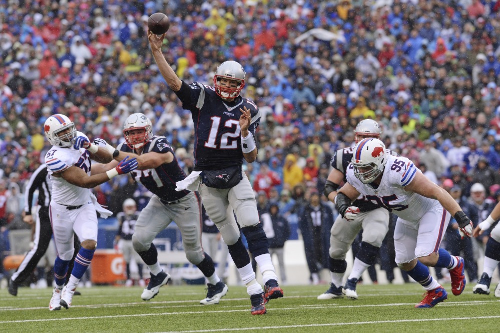 New England Patriots quarterback Tom Brady (12) throws a pass to Danny Amendola for a touchdown during the first half against the Buffalo Bills on Sunday in Orchard Park, New York.