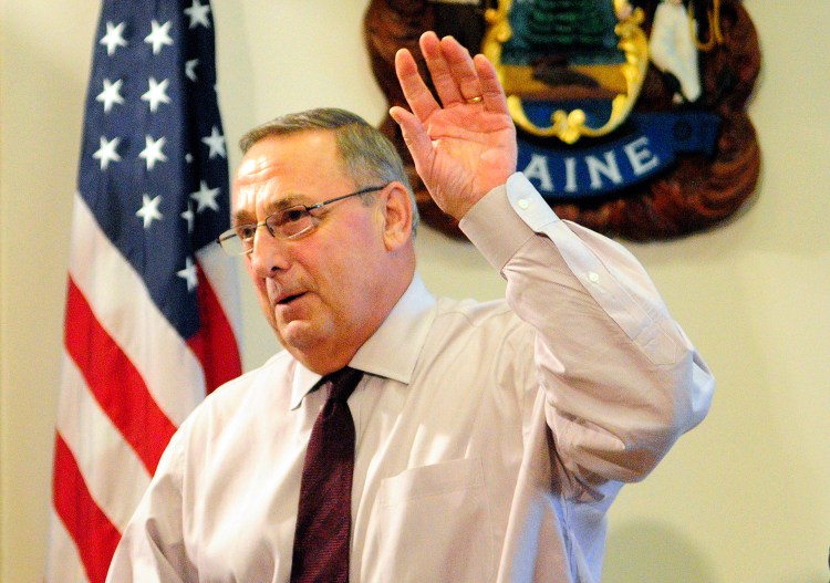 Gov. Paul LePage speaks at a press conference in Augusta on Oct. 12.