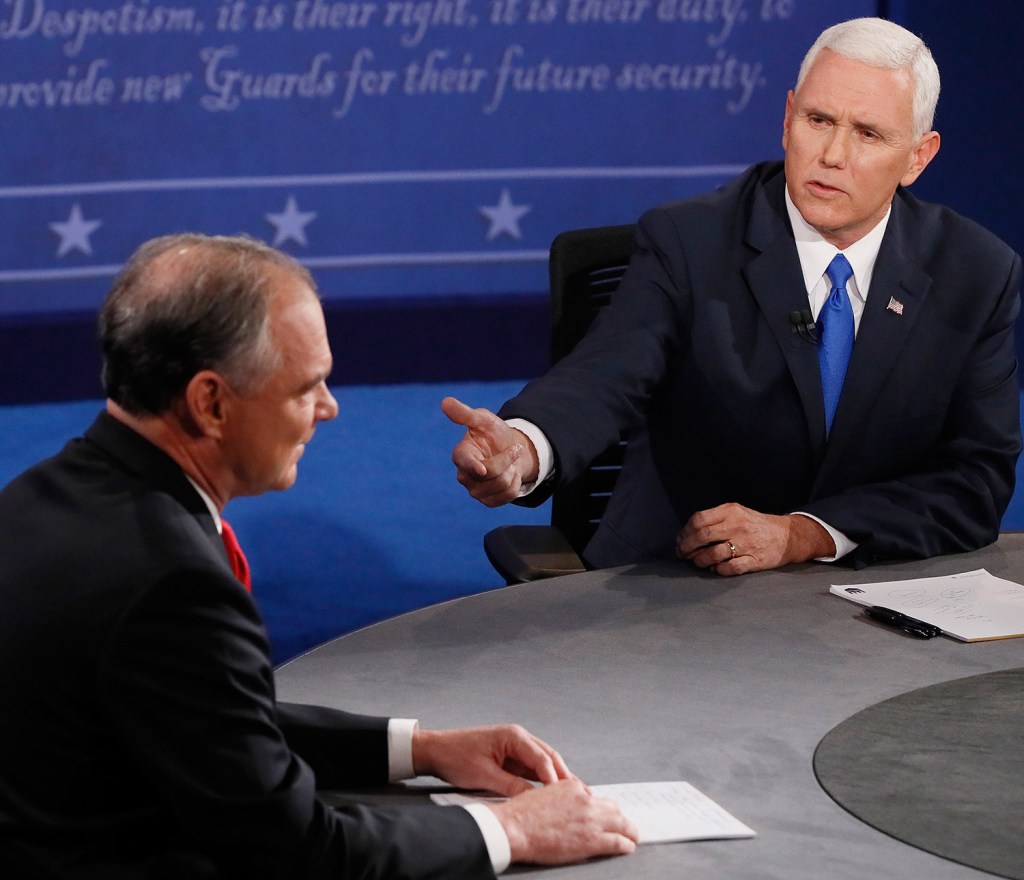 Republican vice presidential nominee Mike Pence, right, detailed his conservative agenda on tax policy, entitlements and immigration during Tuesday night's debate.
Andrew Gombert/Pool via AP