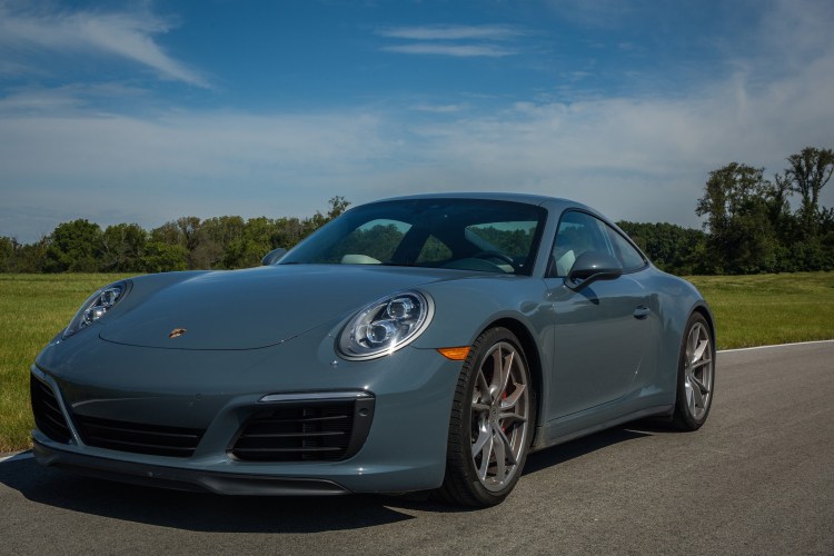 The 2017 Porsche 911 Carrera 4S comes with a button to raise the suspension 1.5 inches to avoid scraping the splitter when driving over the curb into the driveway. 