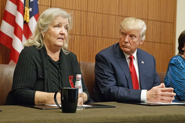 Republican presidential candidate Donald Trump looks on as Juanita Broaddrick, who has accused former President Bill Clinton of sexual assault, speaks before the second presidential debate on Sunday. Associated Press/Evan Vucci