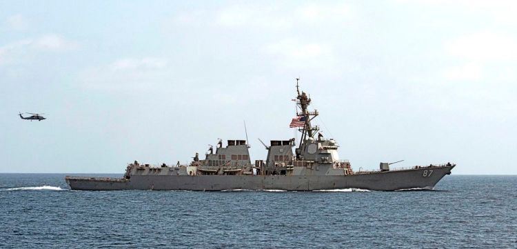 The USS Mason (DDG 87) conducts maneuvers in the Gulf of Oman on Sept. 10, 2016. On Oct. 12, for the second time in a week, two missiles were fired at the Mason in the Red Sea as it conducted operations in the region with the USS Ponce, an amphibious warship. <em>Mass Communication Specialist 1st Class Blake Midnight/U.S. Navy via AP</em>