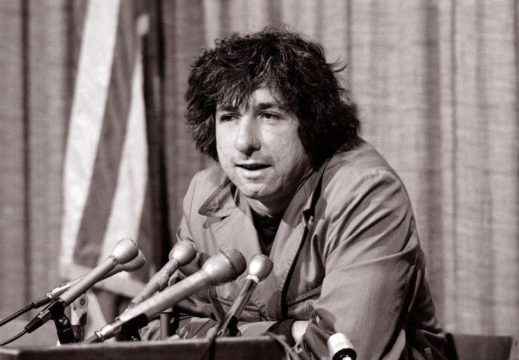 Political activist Tom Hayden, answering questions at a news conference in Los Angeles in 1973, says public support was partially responsible for the judge's decision not to send him and others of the Chicago 7 to jail for contempt. <em>Associated Press/George Brich</em>