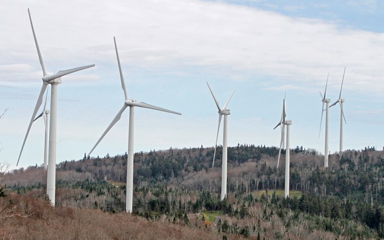 Wind turbines line the hillside at First Wind's project in Sheffield, Vt. Government officials in Vermont, Canada and Australia have dismissed concerns about the health effects of noise from wind power turbines, but don’t tell that to people living near them. <em>Toby Talbot/Associated Press</em>