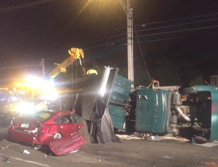 A dump truck overturned and crushed a car as part of a 10-vehicle crash on Route 1 in York on Thursday.