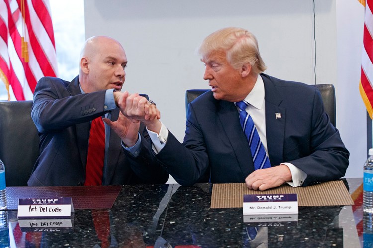 Republican presidential candidate Donald Trump shakes hands with Art Del Cueto during a meeting with members of the National Border Patrol Council at Trump Tower, Friday New York. <em>Evan Vucci/Associated Press</em>
