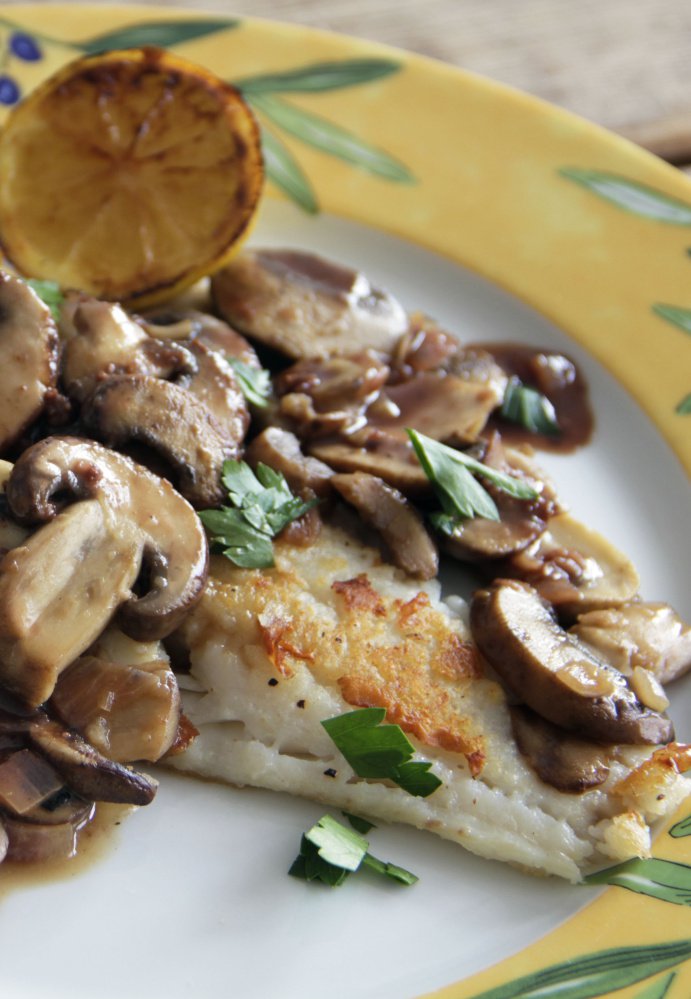 Cod with red wine pan sauce and mushrooms.