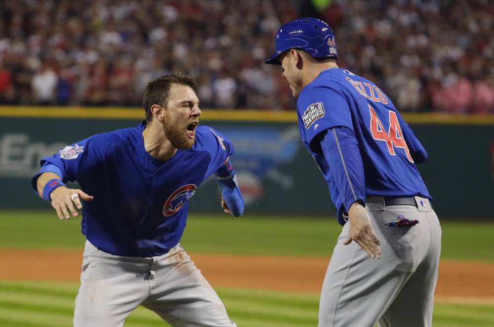 Chicago's Ben Zobrist celebrates with Anthony Rizzo after scoring in the first inning Tuesday night. The Cubs jumped out to a lead that they never gave up.
