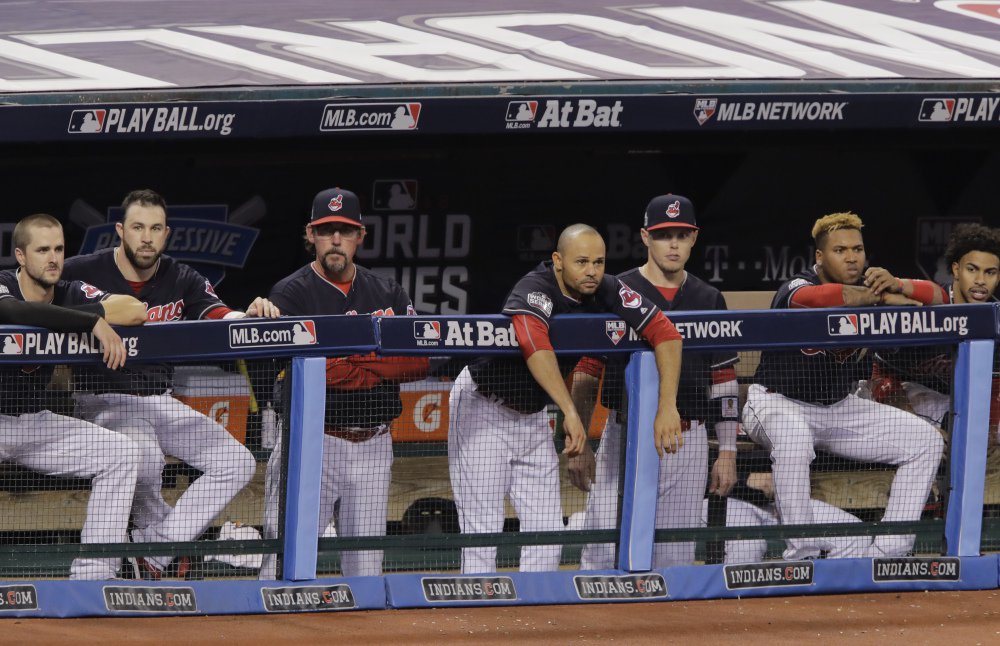 Cleveland players watch from the dugout in the decisive third inning of Game 6, watching their lead in the World Series slip away.