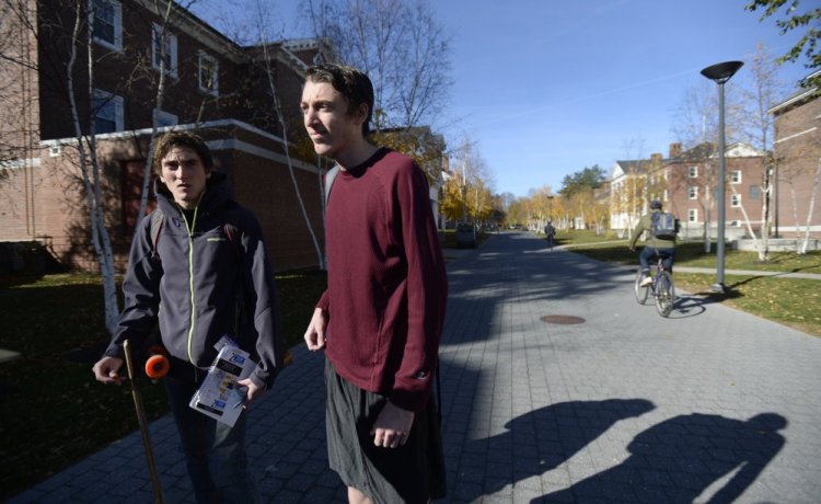 Bates College students Bryce O'Brien, left, of Bristol, R.I., and Justin Levine of Boca Raton, Fla., discuss the fliers circulated on the campus that could be viewed as an attempt at voter suppression. O'Brien said he's heard a lot of students describe the fliers as "disgusting."