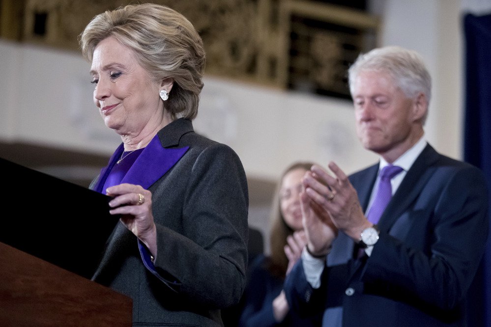 Democratic presidential candidate Hillary Clinton, left, accompanied by her husband former President Bill Clinton, finishes speaking at the New Yorker Hotel in New York on Wednesday, when she conceded her defeat to Republican Donald Trump after the hard-fought presidential election.