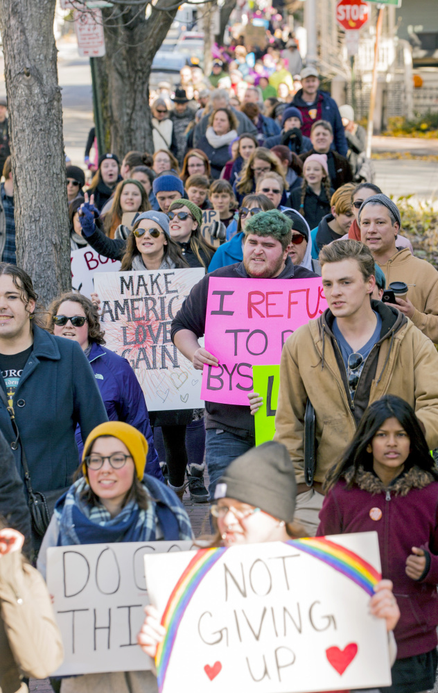 Hundreds of activists march along Pine Street on their way from Eastern to Western promenades in Portland on Saturday. The event drew about 400 participants.