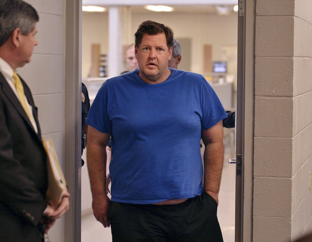 Todd Kohlhepp is escorted into a Spartanburg courtroom on Friday. Kohlhepp, a 45-year-old registered sex offender with a previous kidnapping conviction, allegedly killed 7 people.