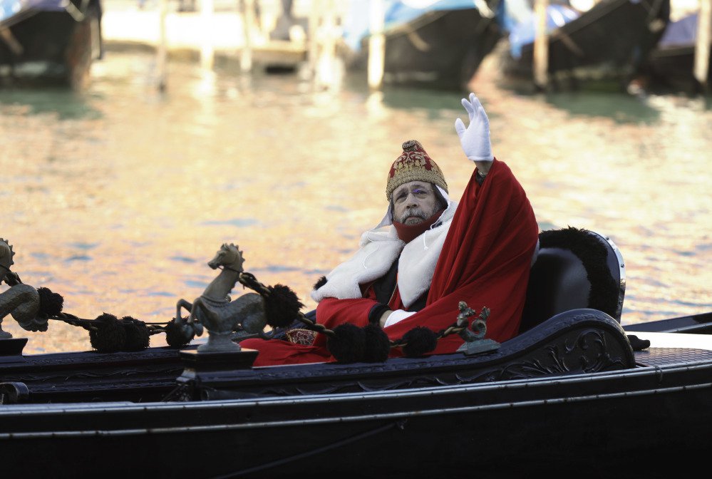 A protester on a gondola impersonates the "Doge of Venice" during a demonstration against the increasing number of tourists in Venice on Saturday.