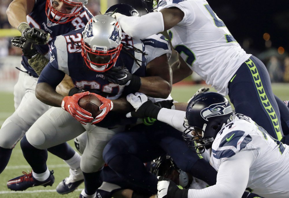 Patriots running back LeGarrette Blount scores in the first half Sunday night against the Seattle Seahawks at Gillette Stadium. The Patriots lost for just the second time this season, 31-24.