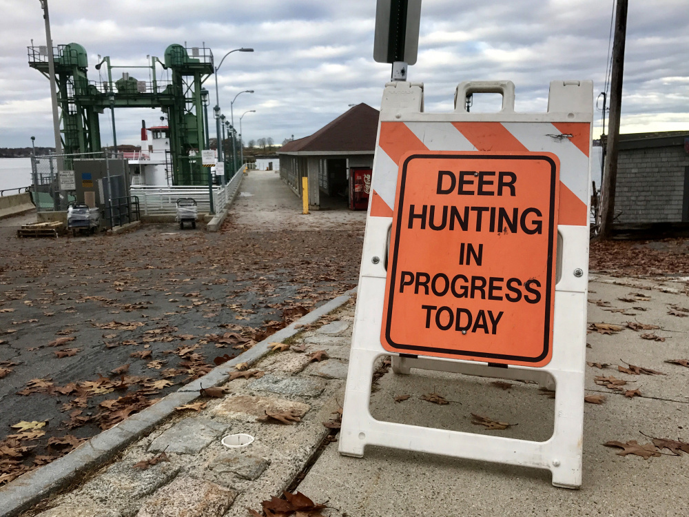 Signs placed near ferry landings alert islanders that Portland's annual deer hunt is underway. Hunters do not roam the islands; the deer are lured to designated bait sites.