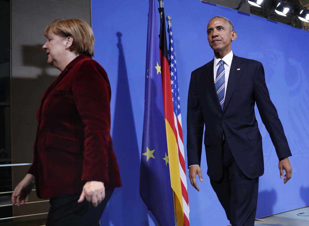 President Barack Obama and German Chancellor Angela Merkel leave after their joint news conference Thursday at the German Chancellery in Berlin.