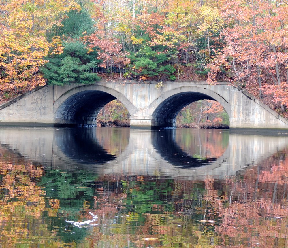 The two tunnels of an old rail road bridge, a mile south of Rogers Pond Park in Kennebunk, are among the interesting features of a paddle along the Mousam River.