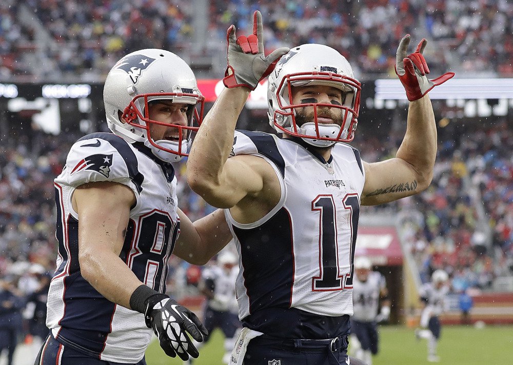 Patriots wide receiver Julian Edelman, right, celebrates with Danny Amendola after catching a touchdown pass Sunday during New England's 30-17 win over the San Francisco 49ers in Santa Clara, Calif.