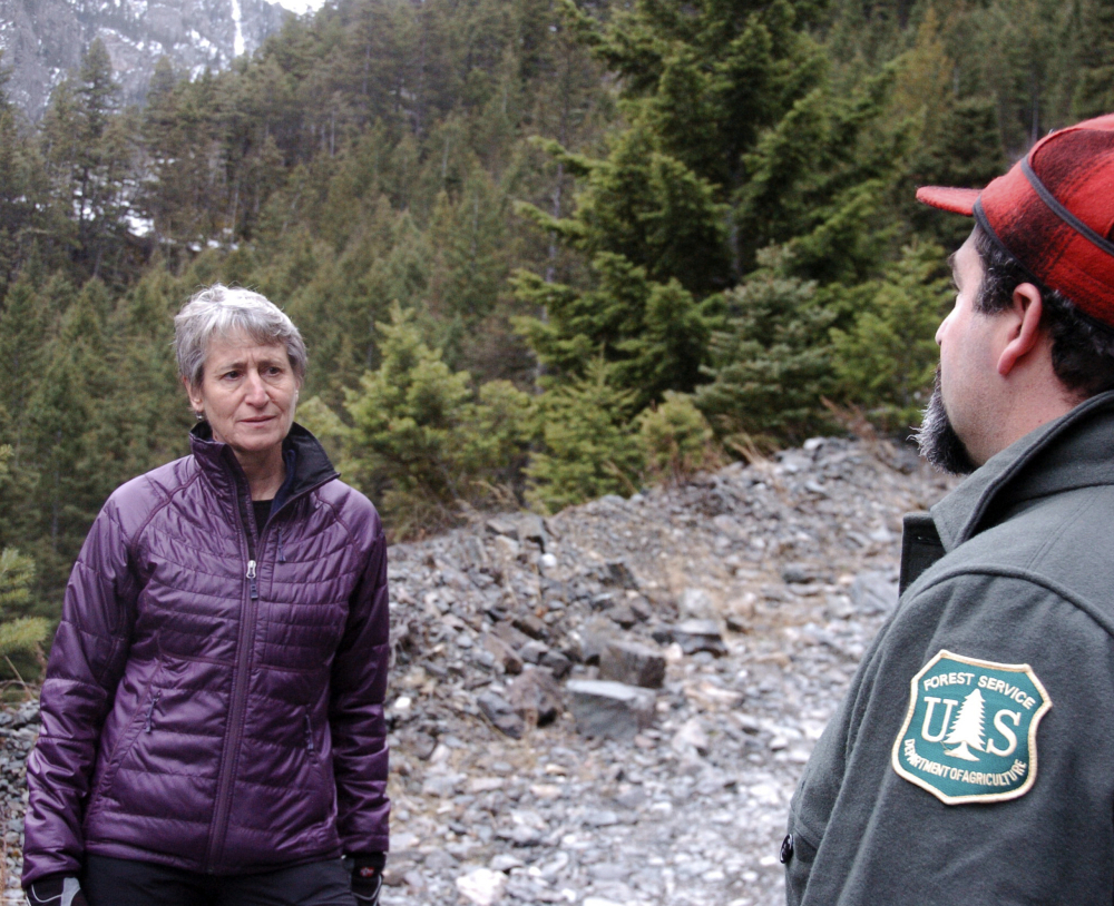 US Interior Secretary Sally Jewell, left, listens to a Forest Service official talk about the impacts of mining in the Absaroka Mountains near Pray, Mont., on Monday.