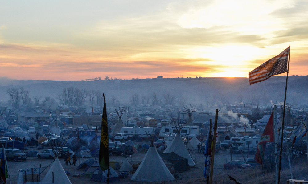 The sun rises over Oceti Sakowin camp during the ongoing protest against plans to build the Dakota Access pipeline near the Standing Rock Indian Reservation, near Cannon Ball, N.D.