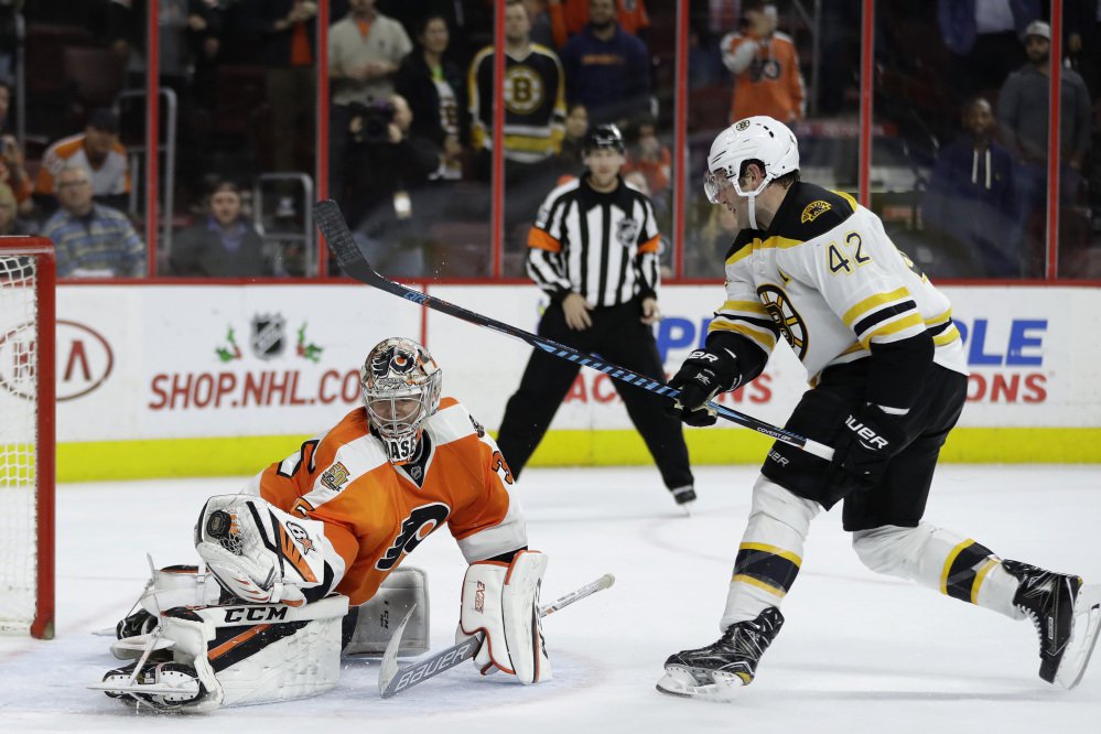 Philadelphia goalie Steve Mason blocks a shot by the Bruins' David Backes to end the overtime shootout and give the Flyers a 3-2 win Tuesday night.