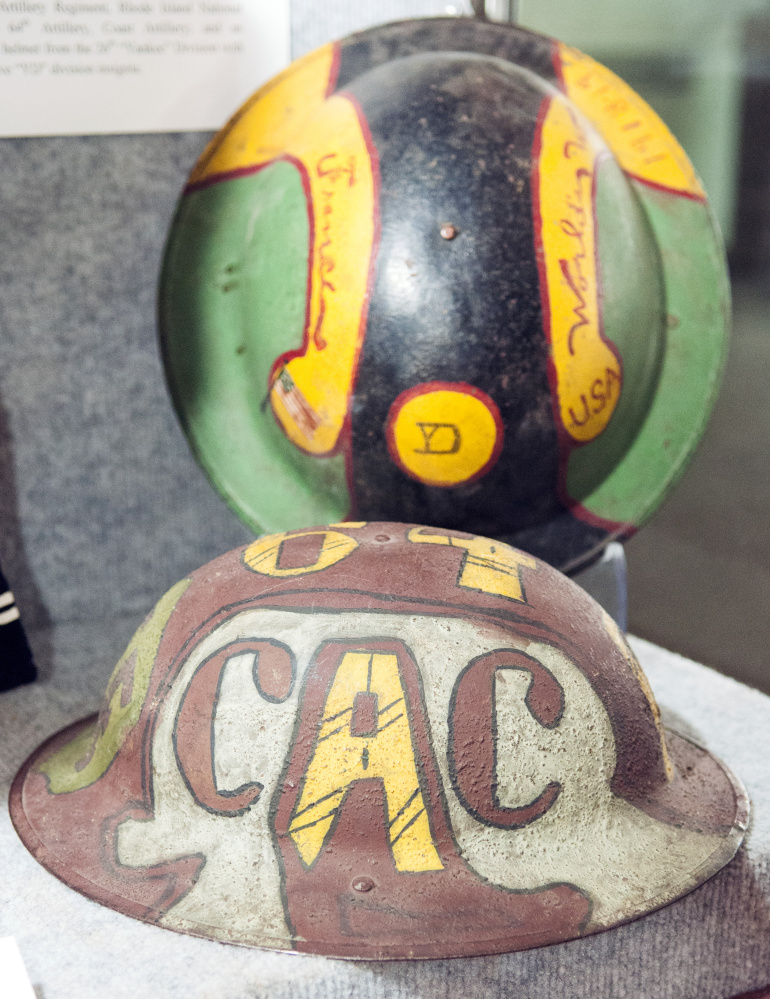 World War I helmets painted with unit insignia were among the items displayed during the Pop Up Museum event Saturday in the Cultural Building in Augusta.