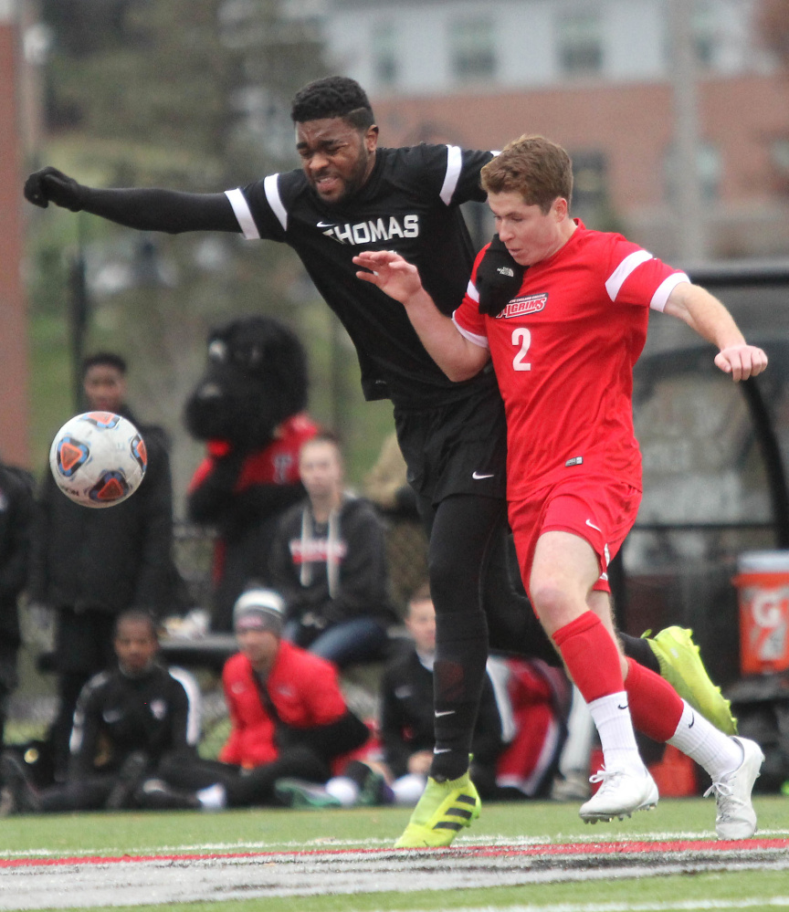 Thomas College's MacQuille Walker battles for the ball with New England College's Cooper Valinski in the first half of the North Atlantic Conference championship in Waterville on Saturday night.