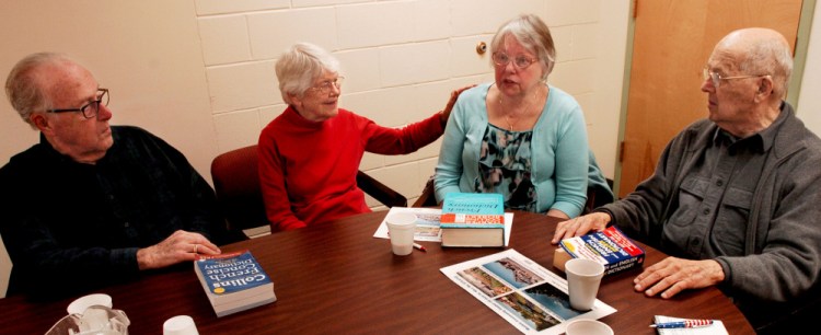 This group regularly meets at Senior Spectrum's Muskie Center in Waterville, where they socialize and speak French to keep the language active in their lives. When they run into a word they forgot or have not used, there are French and English dictionaries available. From left are Gerald Michaud, Cecile Vigue, Claire Ryan and Lucien Veilleux.
