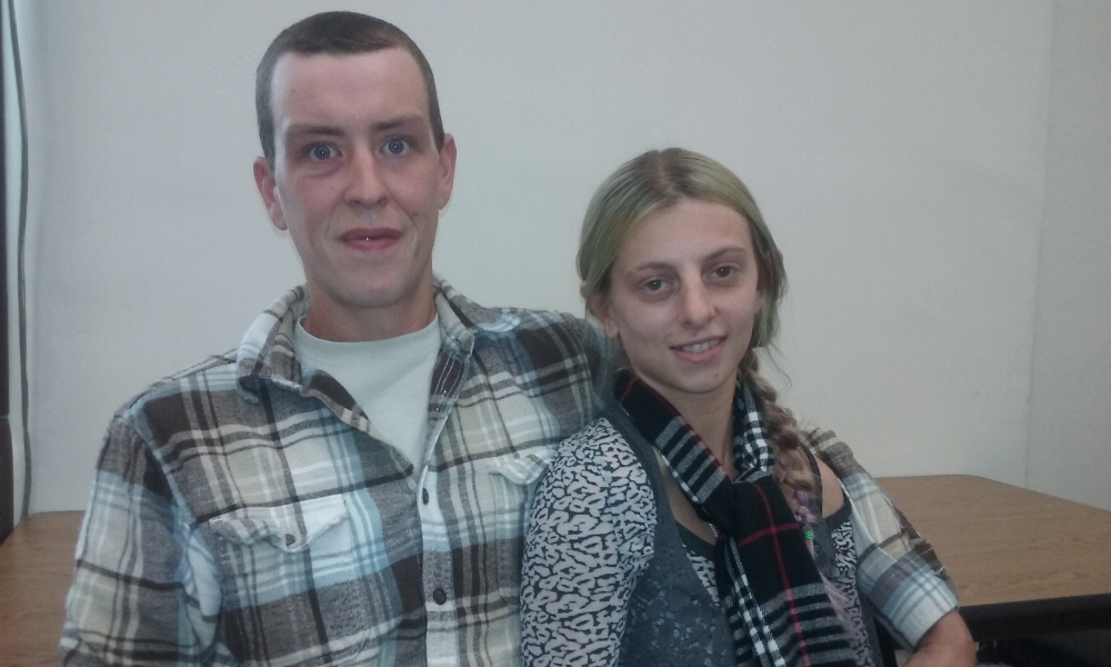 Mike Nichols, left, and his girlfriend, Sara Cookson, seen Monday in Somerset County Superior Court in Skowhegan, discuss how drug addiction has fueled Nichols' property crimes.