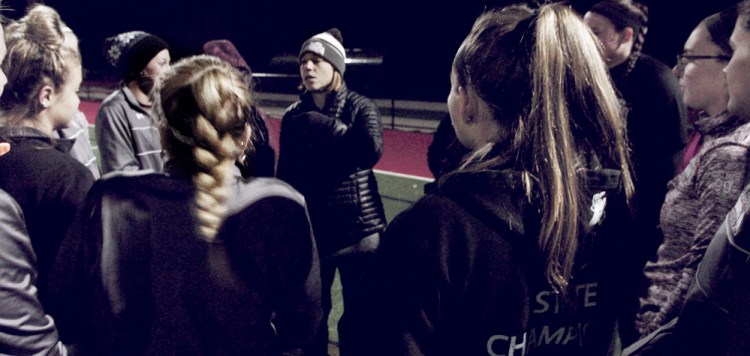 University of Maine at Farmington head field hockey coach Cyndi Pratt speaks with the team during practice Monday at Thomas College in Waterville.