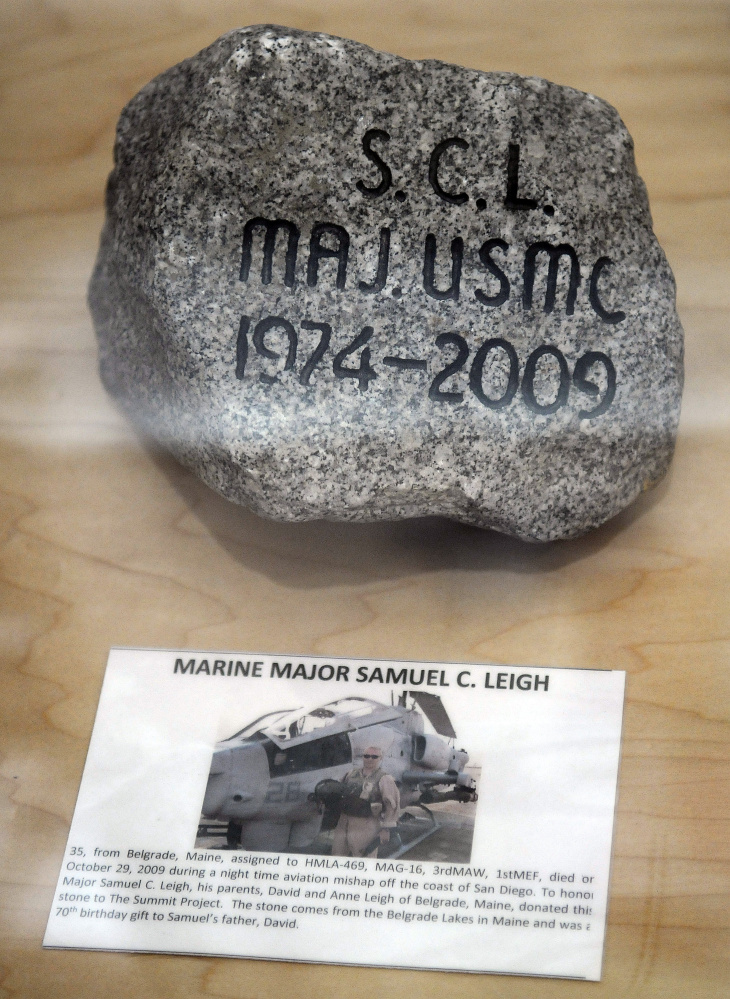 A stone in memory of Marine Corps Maj. Samuel Leigh stands on display Thursday at the Togus VA as part of the Summit Project. Stones picked by relatives of several veterans who have died since Sept. 11, 2001, are on display in the lobby of the hospital. A Belgrade resident, Leigh was a 13-year veteran of the Marine Corps who served two tours of duty in Iraq before dying in an aerial accident on Oct. 29, 2009.