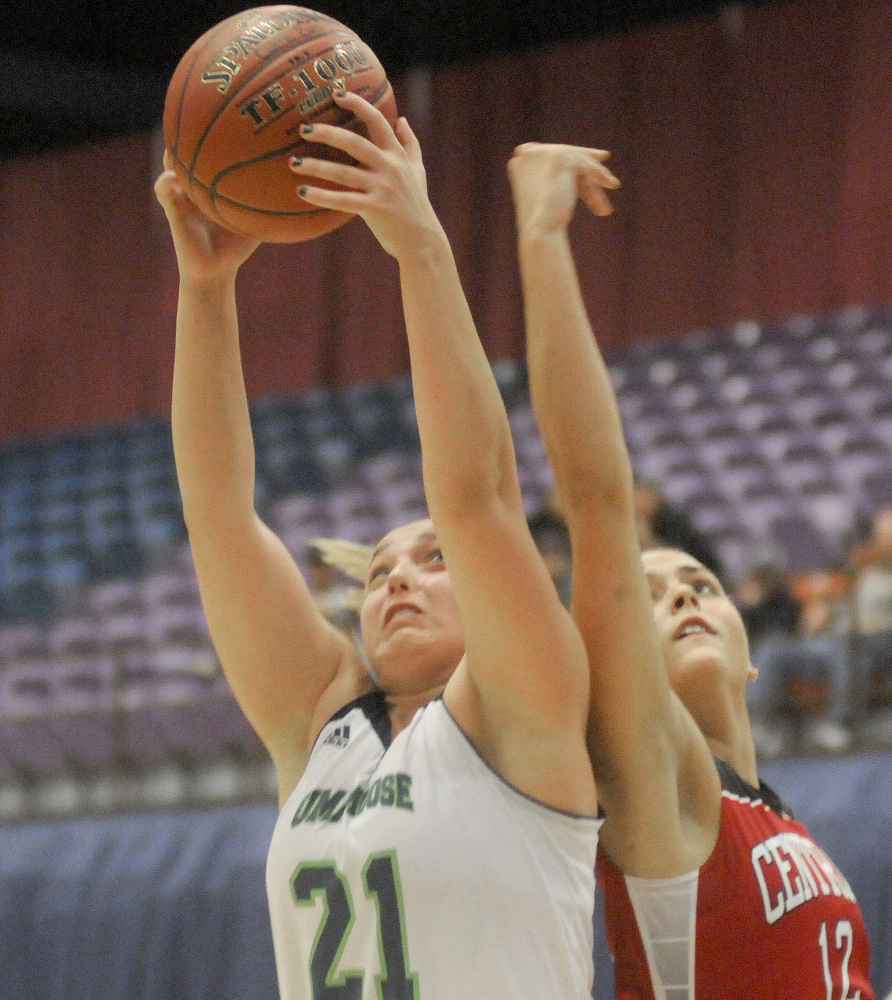 University of Maine at Augusta forward Caitlin LaFountain, left, snags a rebound away from Central Maine Community College's Brooke Reynolds during a game Thursday night at the Augusta Civic Center.